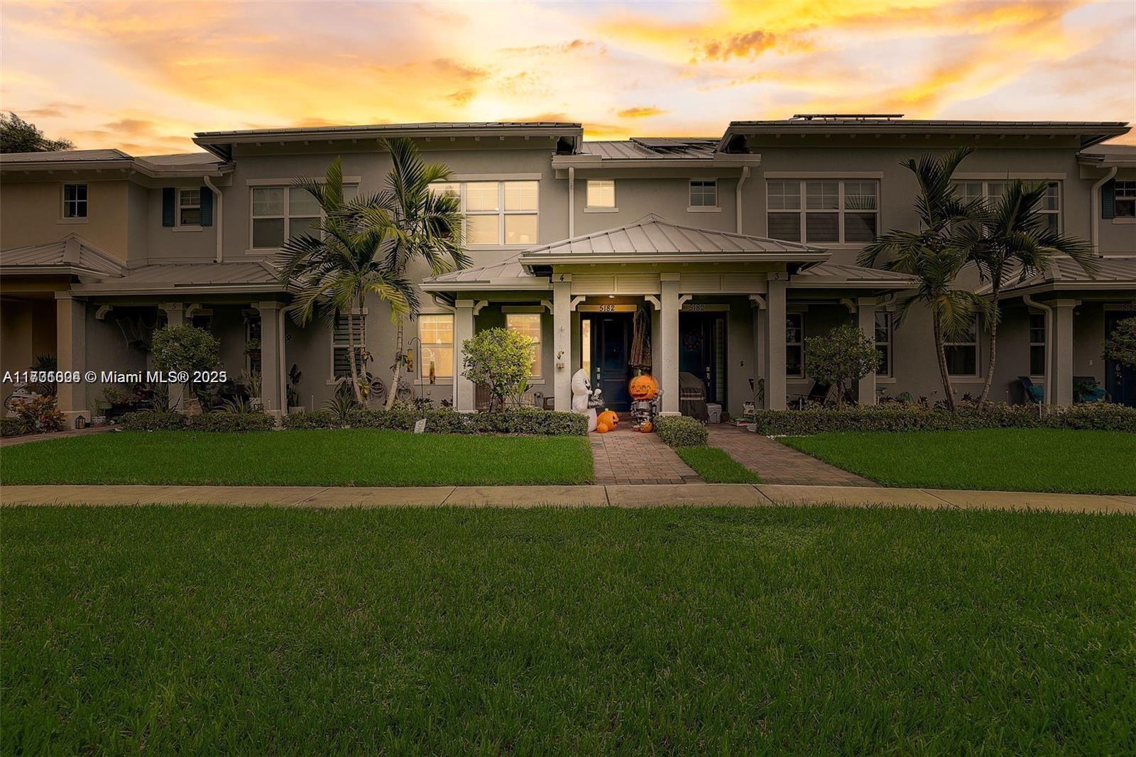 5182 Eucalyptus Drive, Unit 4 Hollywood, FL 33021 - Photo 4 of 22 a view of a building with a yard