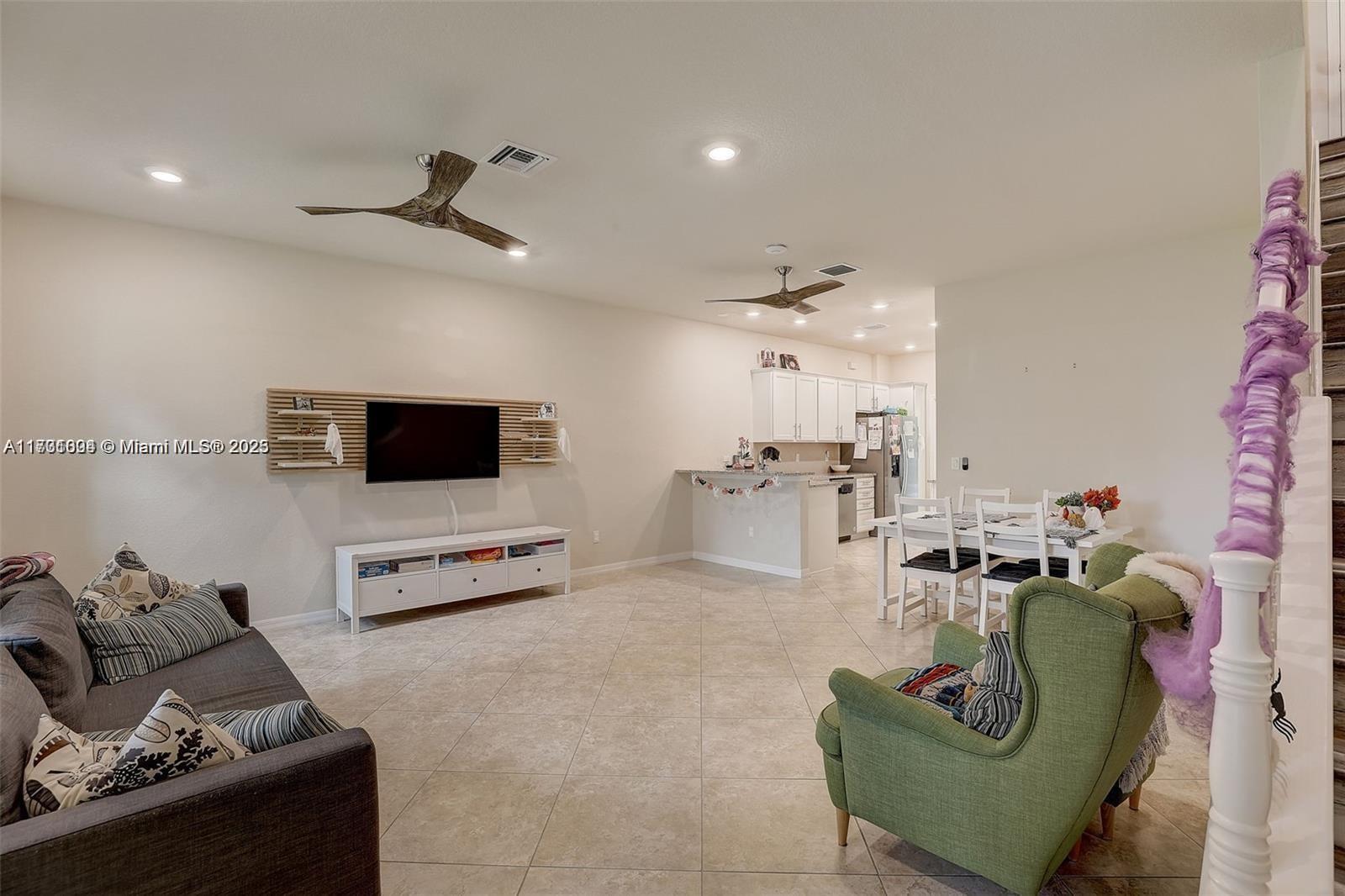 5182 Eucalyptus Drive, Unit 4 Hollywood, FL 33021 - Photo 5 of 22 a living room with furniture and a flat screen tv