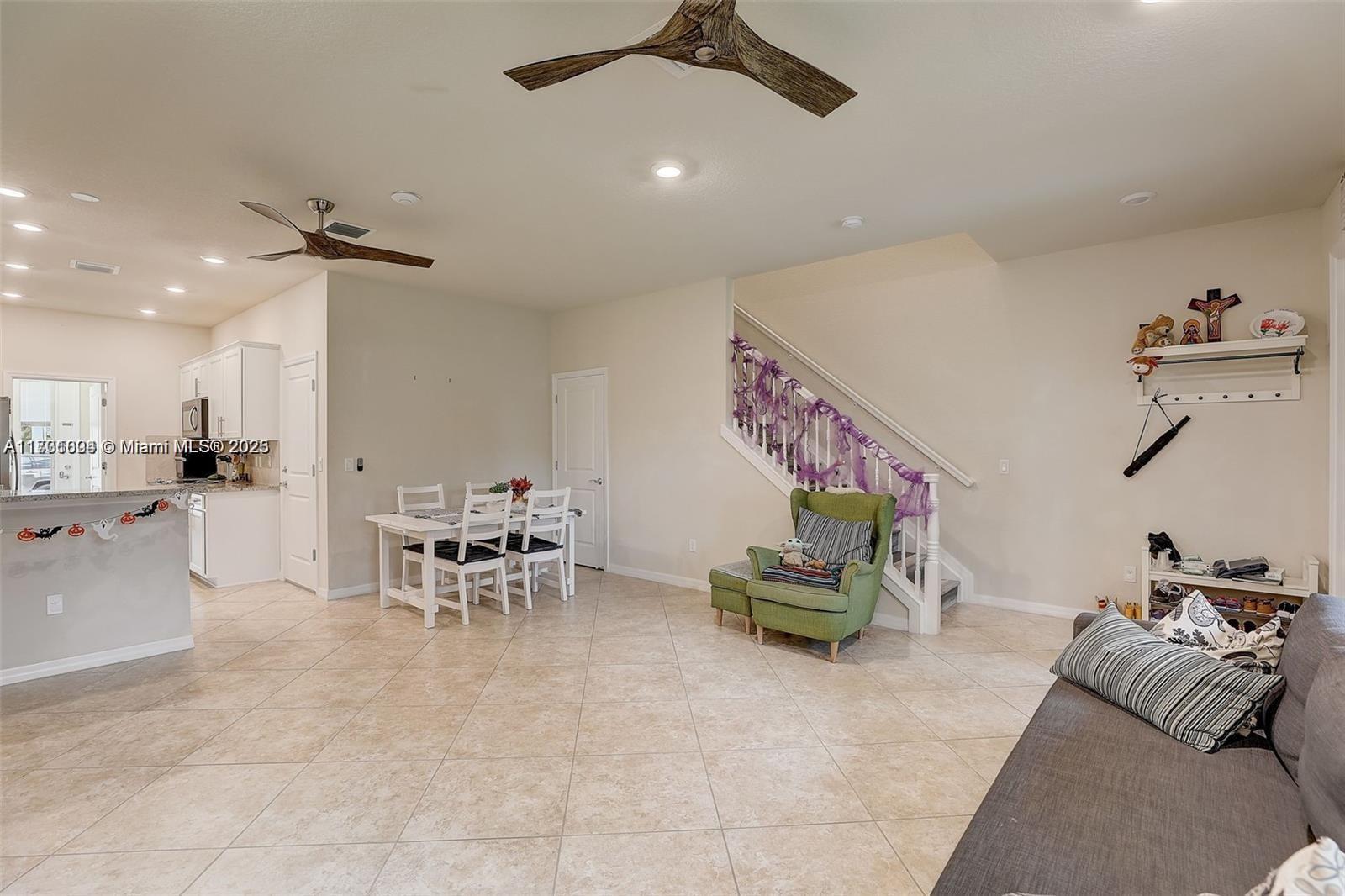 5182 Eucalyptus Drive, Unit 4 Hollywood, FL 33021 - Photo 6 of 22 a living room with furniture and a dining table