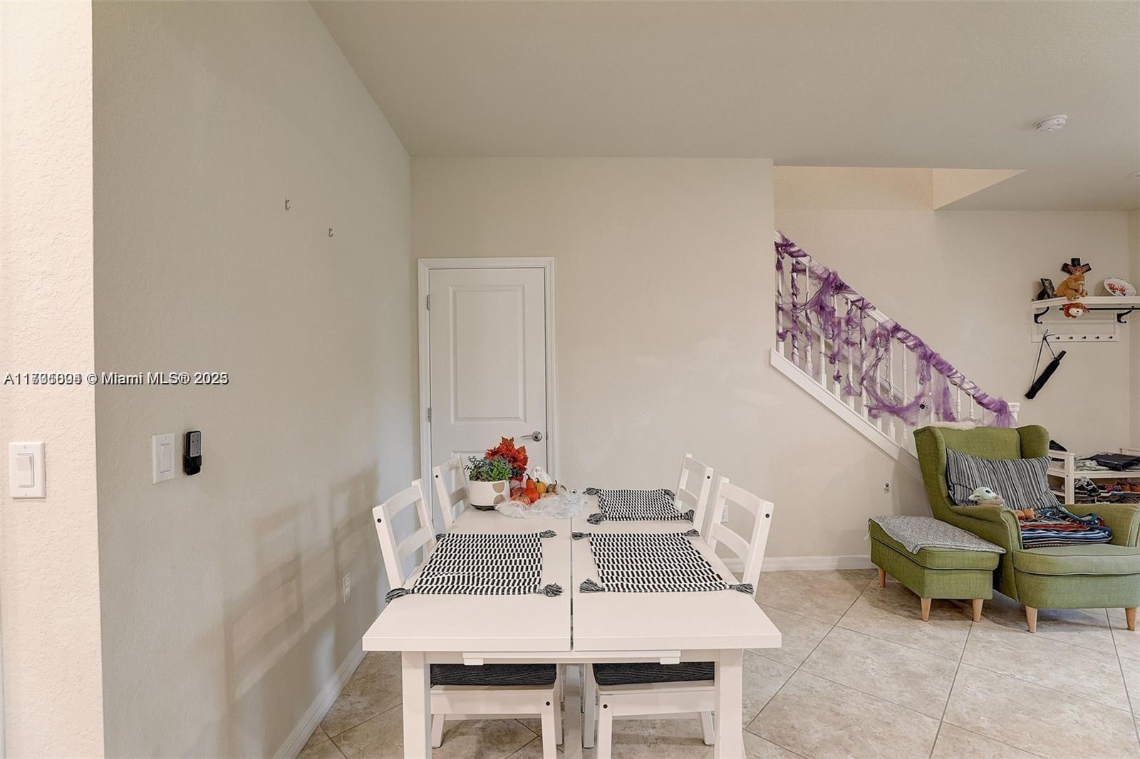 5182 Eucalyptus Drive, Unit 4 Hollywood, FL 33021 - Photo 7 of 22 a dining room with furniture and wooden floor