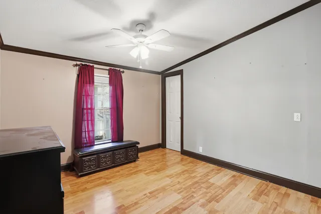 a view of a house with yard and sitting area