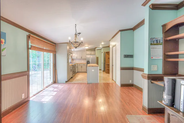 a view of a kitchen with wooden floor