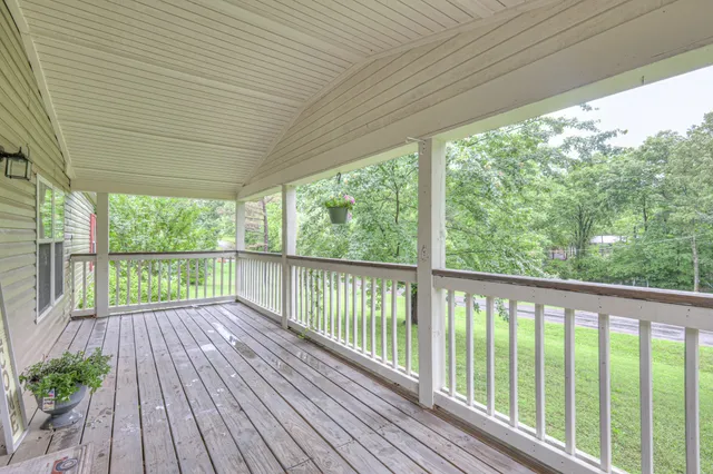 a view of a room with wooden floor and wooden floor