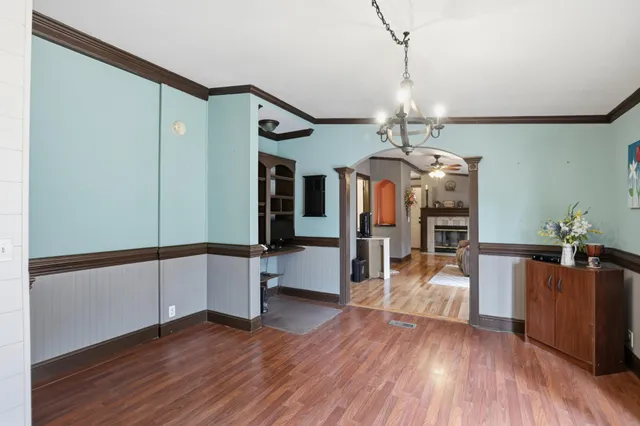 a bathroom with a granite countertop sink a toilet and a mirror