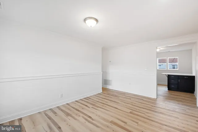 a view of a livingroom with wooden floor