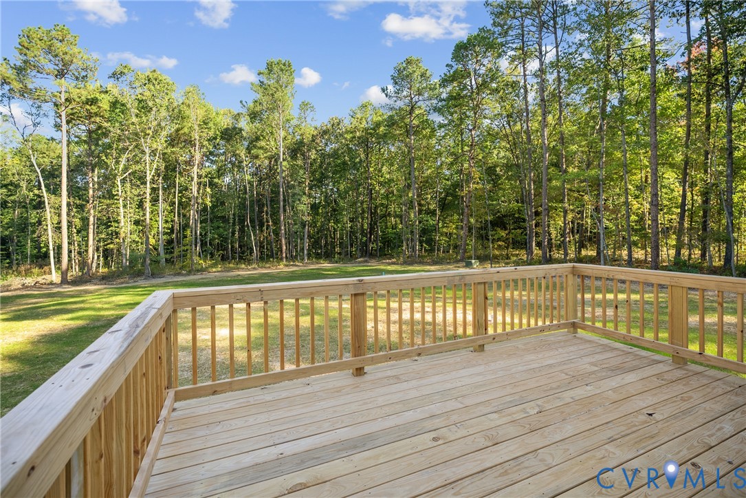 19106 Carson Road Dinwiddie, VA 23841 - Photo 28 of 34 Expansive outdoor deck with natural wood railing o