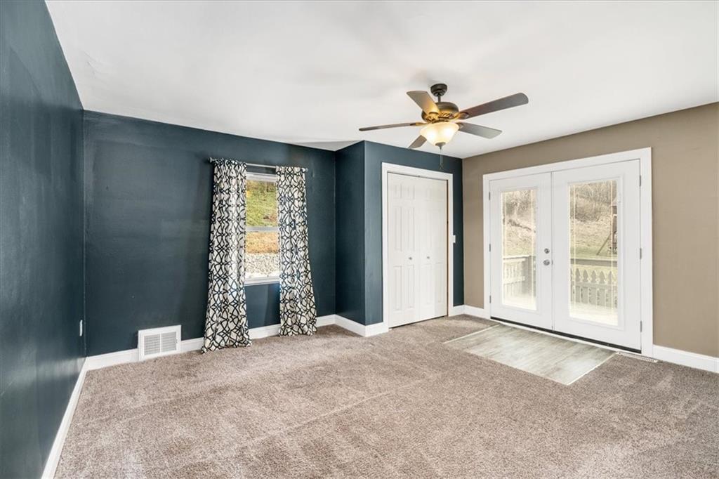 720 Conway Wallrose Road Freedom, PA 15042 - Photo 11 of 25 a bedroom with a bed and a window