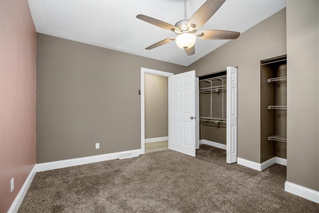 720 Conway Wallrose Road Freedom, PA 15042 - Photo 15 of 25 a view of an empty room with a ceiling fan