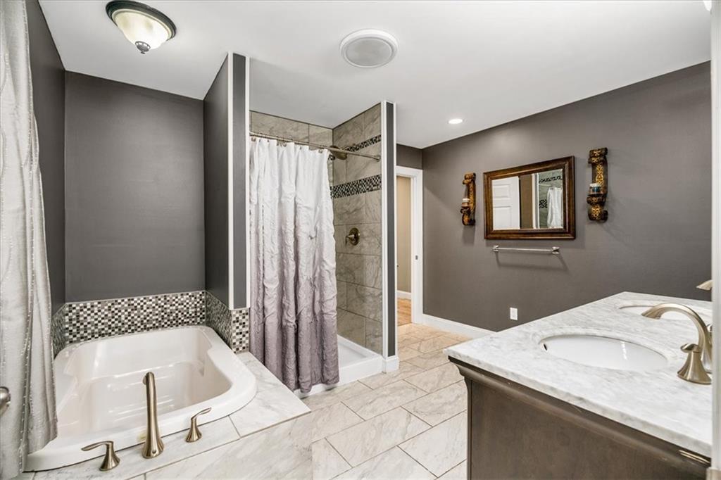 720 Conway Wallrose Road Freedom, PA 15042 - Photo 17 of 25 a bathroom with a tub sink and shower
