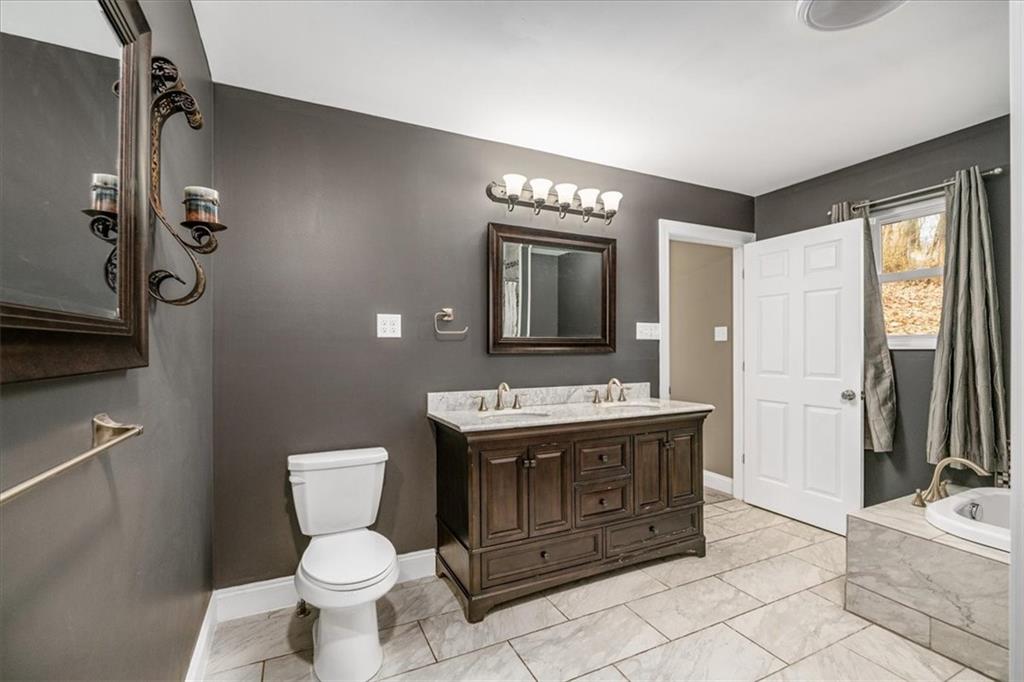 720 Conway Wallrose Road Freedom, PA 15042 - Photo 18 of 25 a bathroom with a toilet sink and mirror