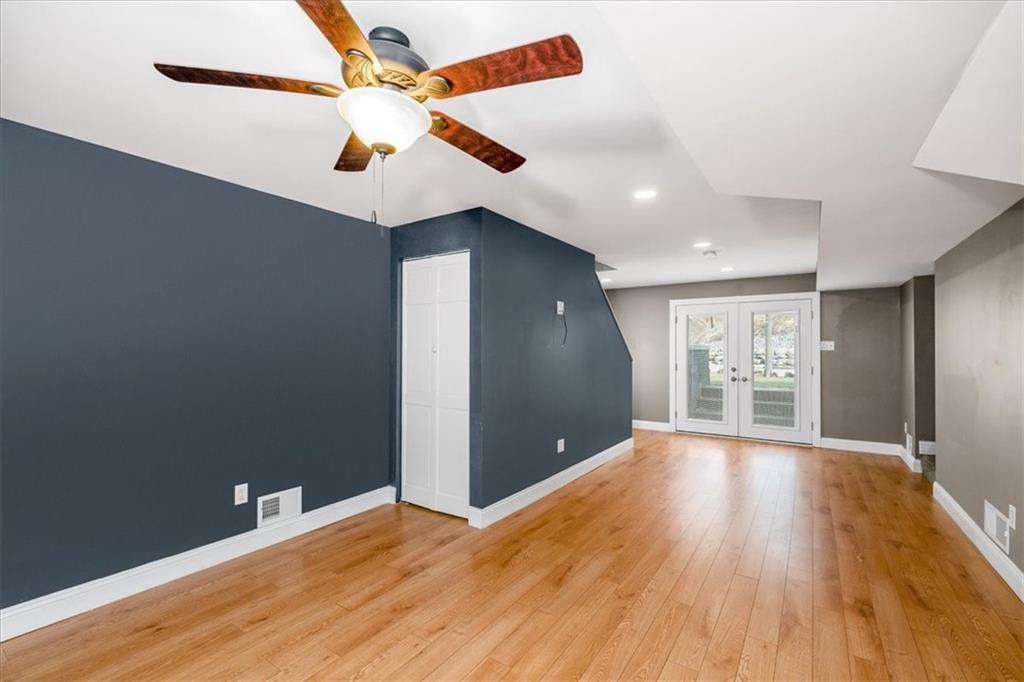 720 Conway Wallrose Road Freedom, PA 15042 - Photo 19 of 25 a view of a livingroom with a ceiling fan and wooden floor