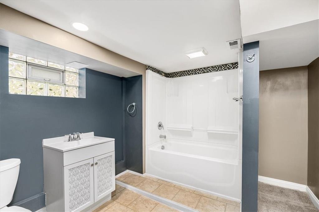 720 Conway Wallrose Road Freedom, PA 15042 - Photo 21 of 25 a bathroom with a sink a toilet and shower