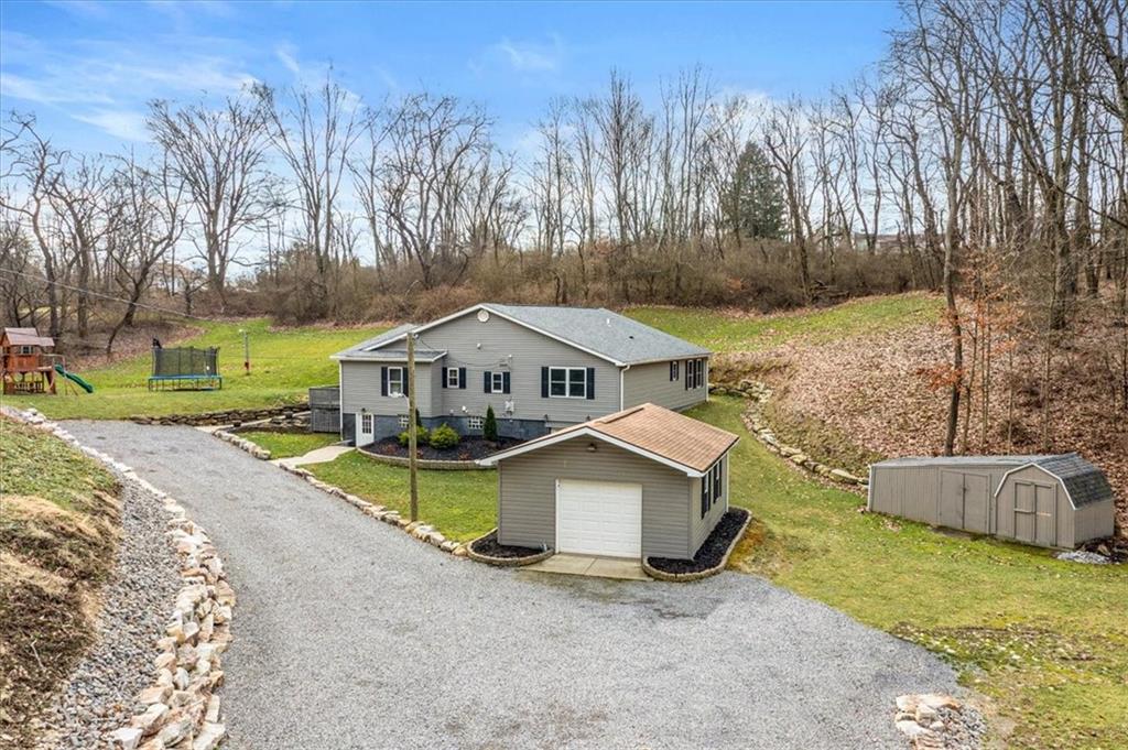 720 Conway Wallrose Road Freedom, PA 15042 - Photo 23 of 25 a house that has a tree in front of it