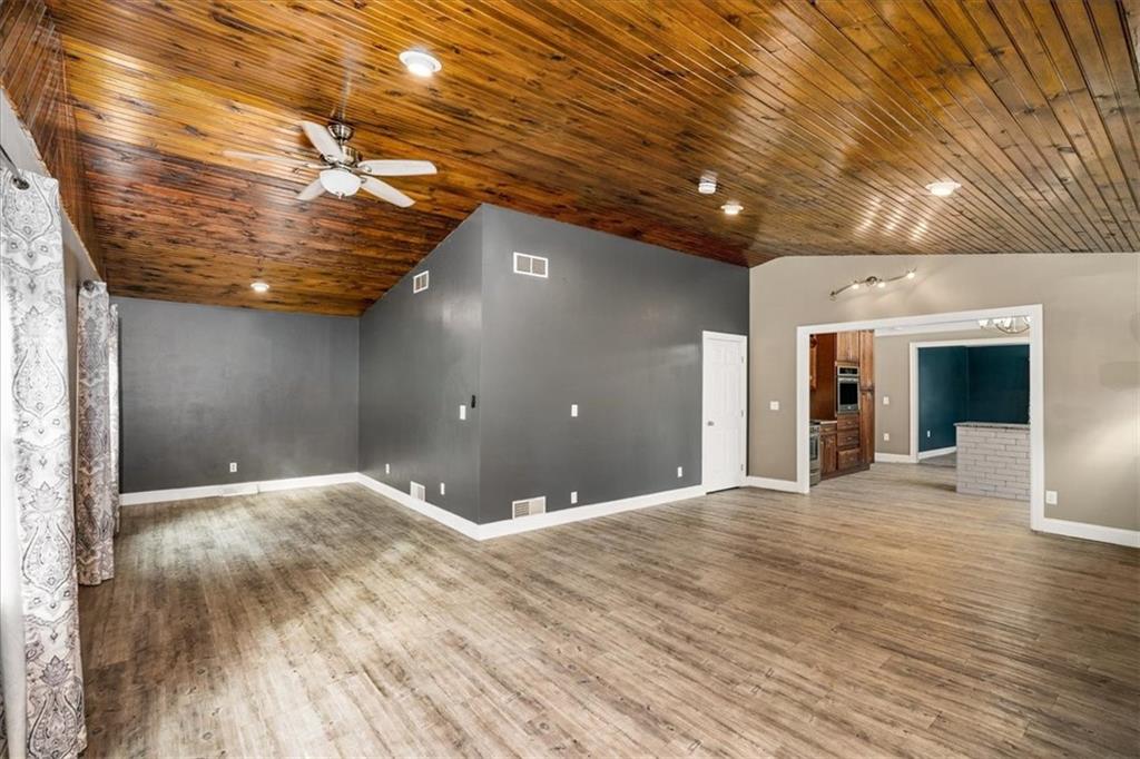 720 Conway Wallrose Road Freedom, PA 15042 - Photo 4 of 25 a view of an empty room with wooden floor