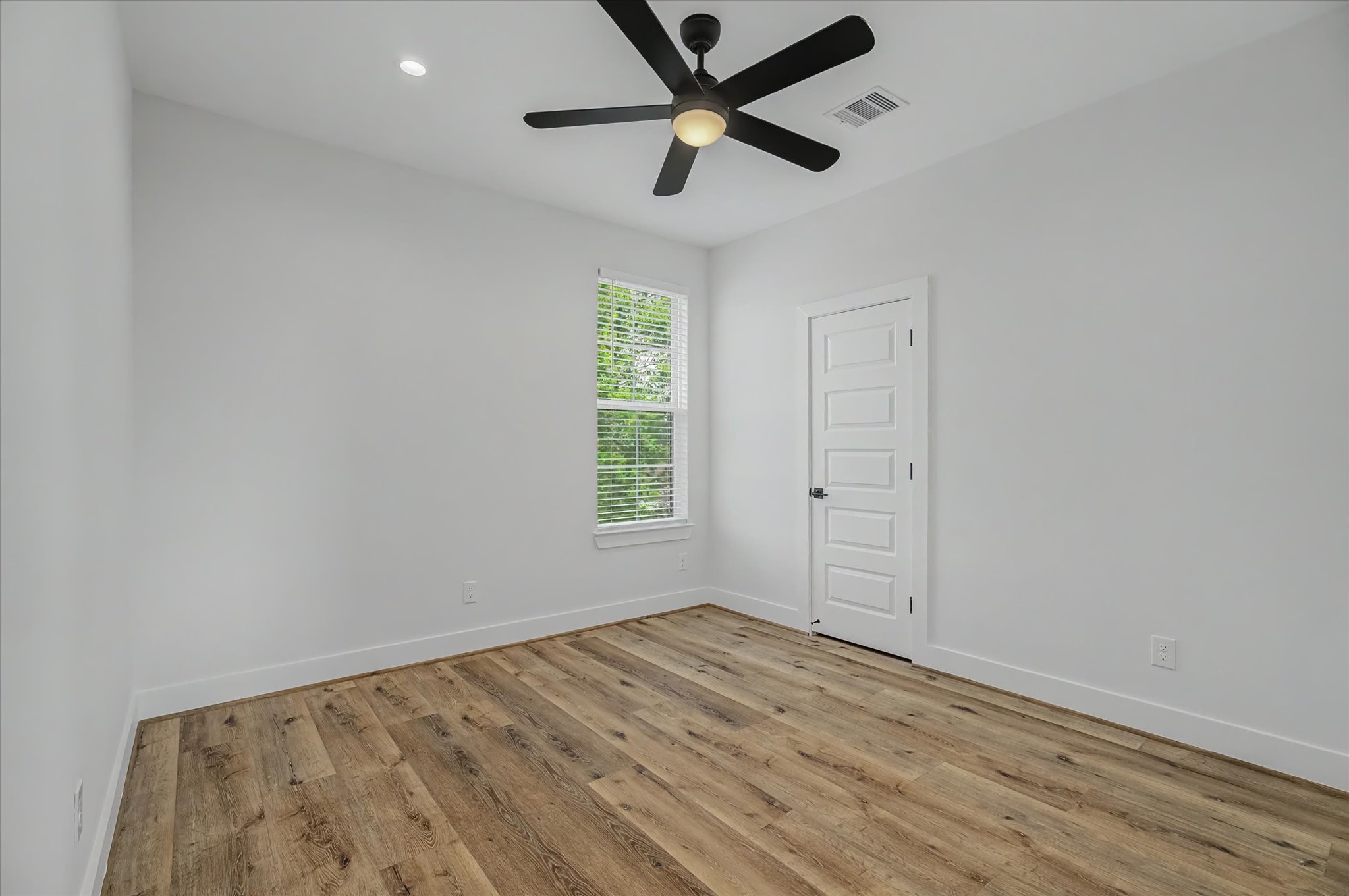 3806 Dreyfus Street Houston, TX 77021 - Photo 33 of 48 Spacious bedroom featuring recessed can lighting and a remote-controlled ceiling fan.