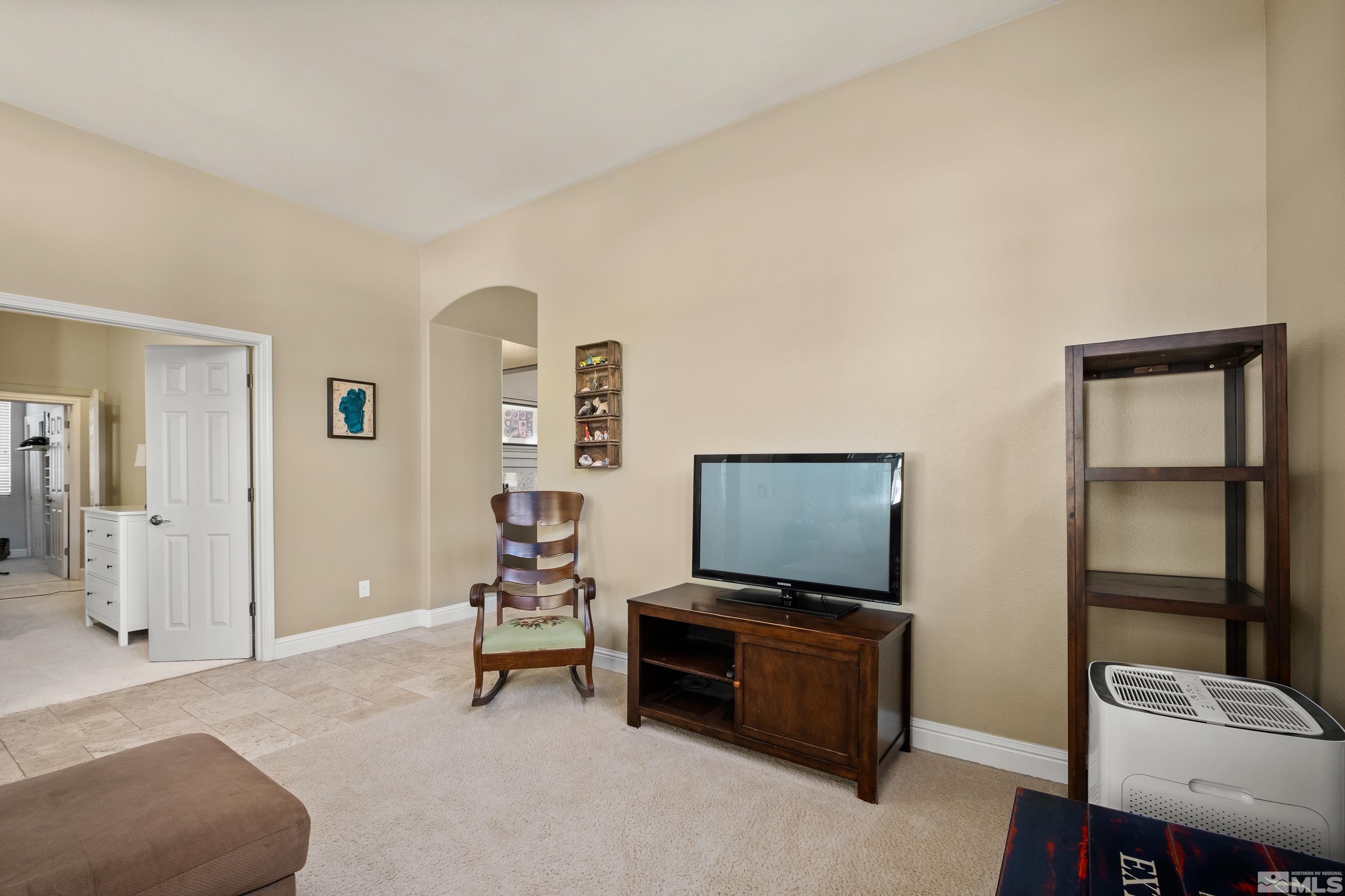 1600 Red Gulch Court Reno, NV 89521 - Photo 11 of 39 a living room with furniture and a flat screen tv
