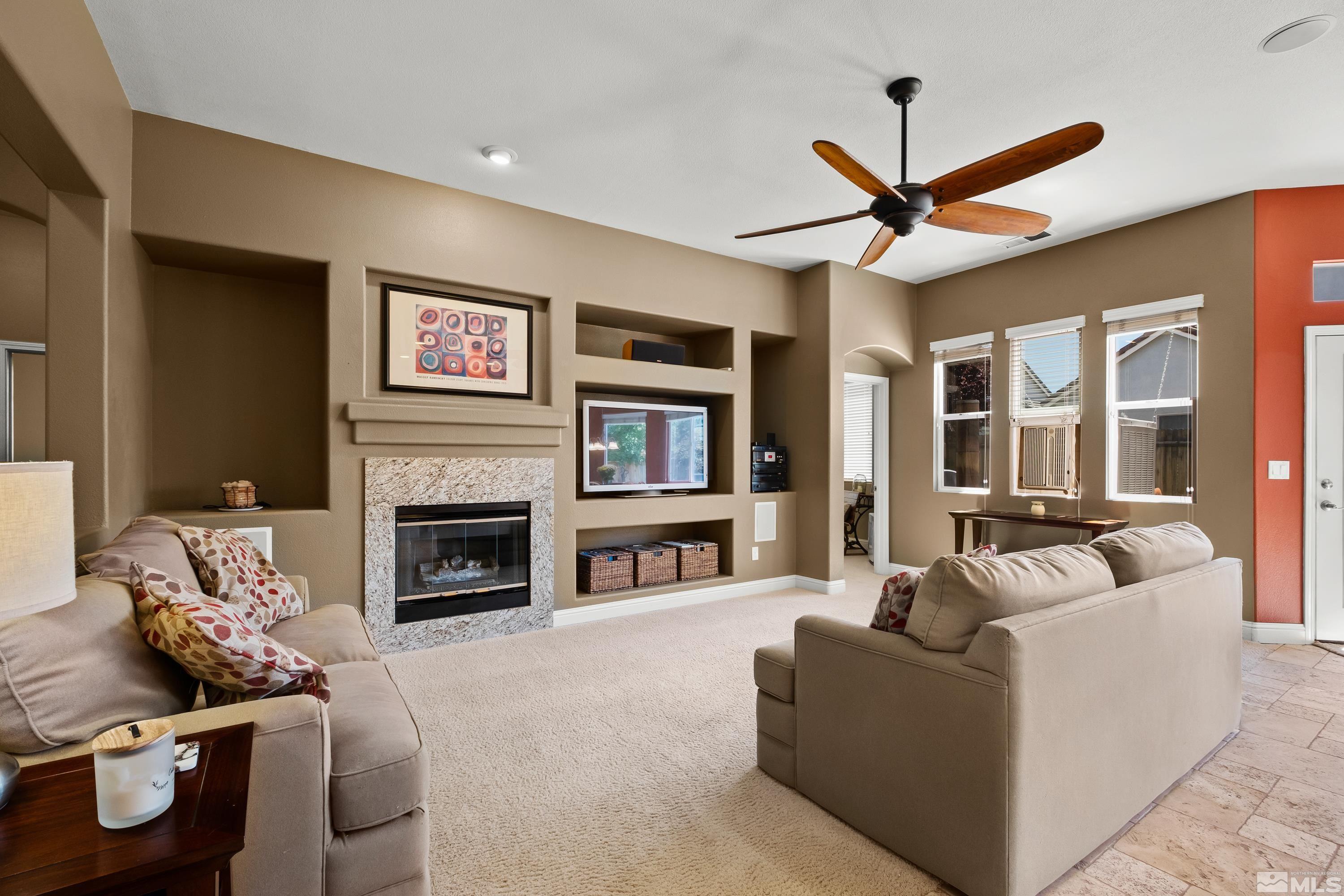1600 Red Gulch Court Reno, NV 89521 - Photo 13 of 39 a living room with furniture and a fireplace