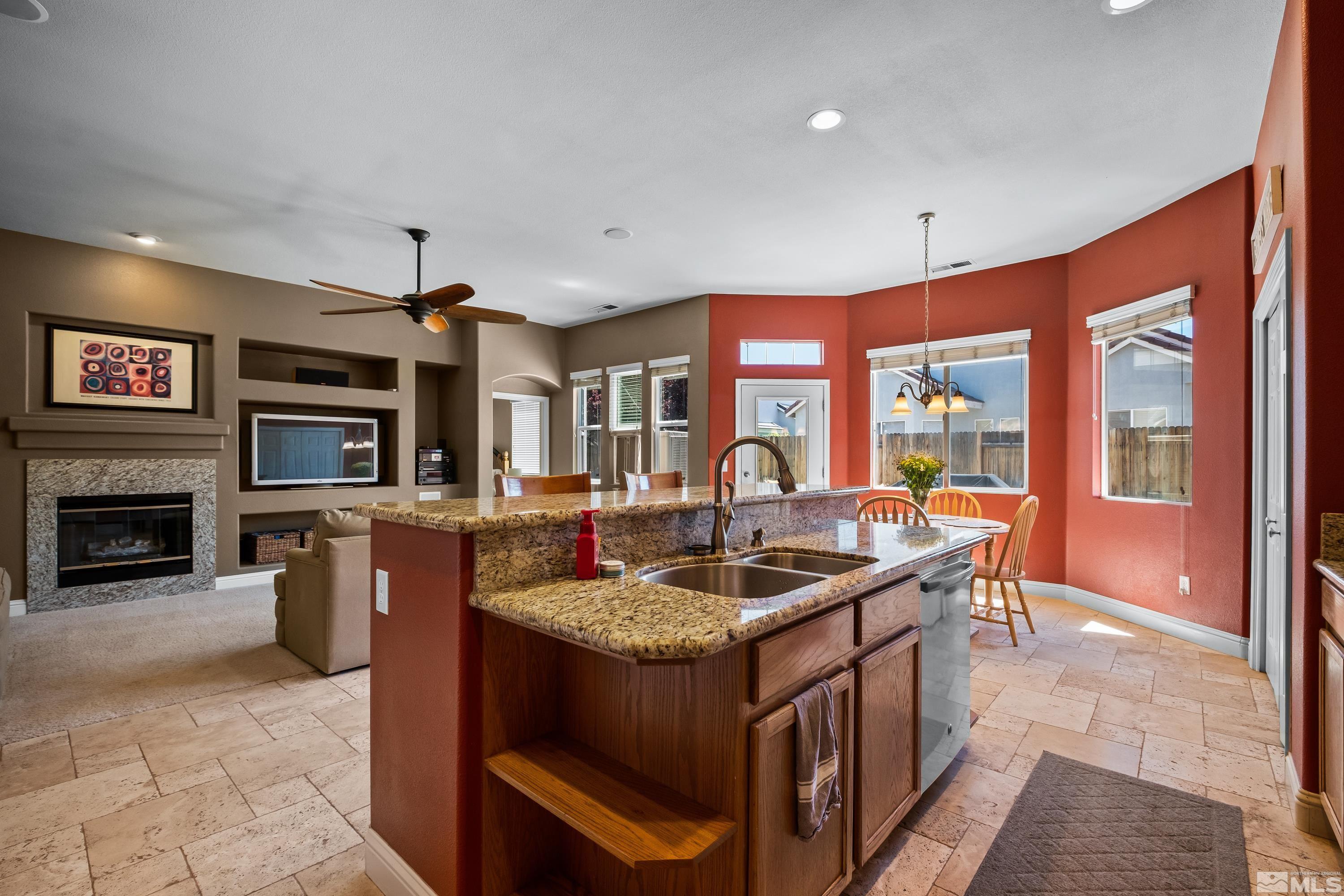 1600 Red Gulch Court Reno, NV 89521 - Photo 17 of 39 a kitchen with stainless steel appliances granite countertop a stove and a sink