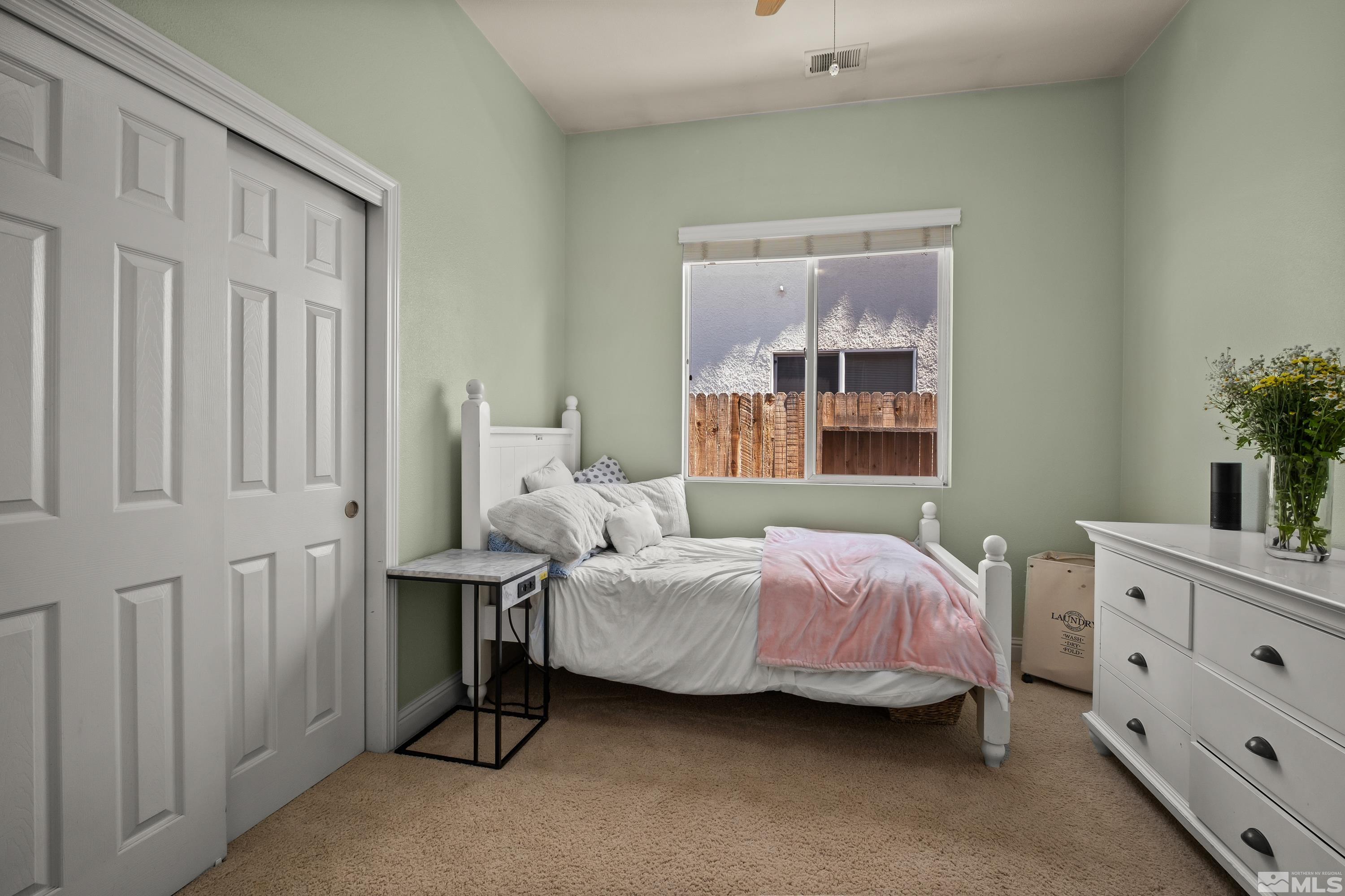 1600 Red Gulch Court Reno, NV 89521 - Photo 18 of 39 a bedroom with a bed and a dresser