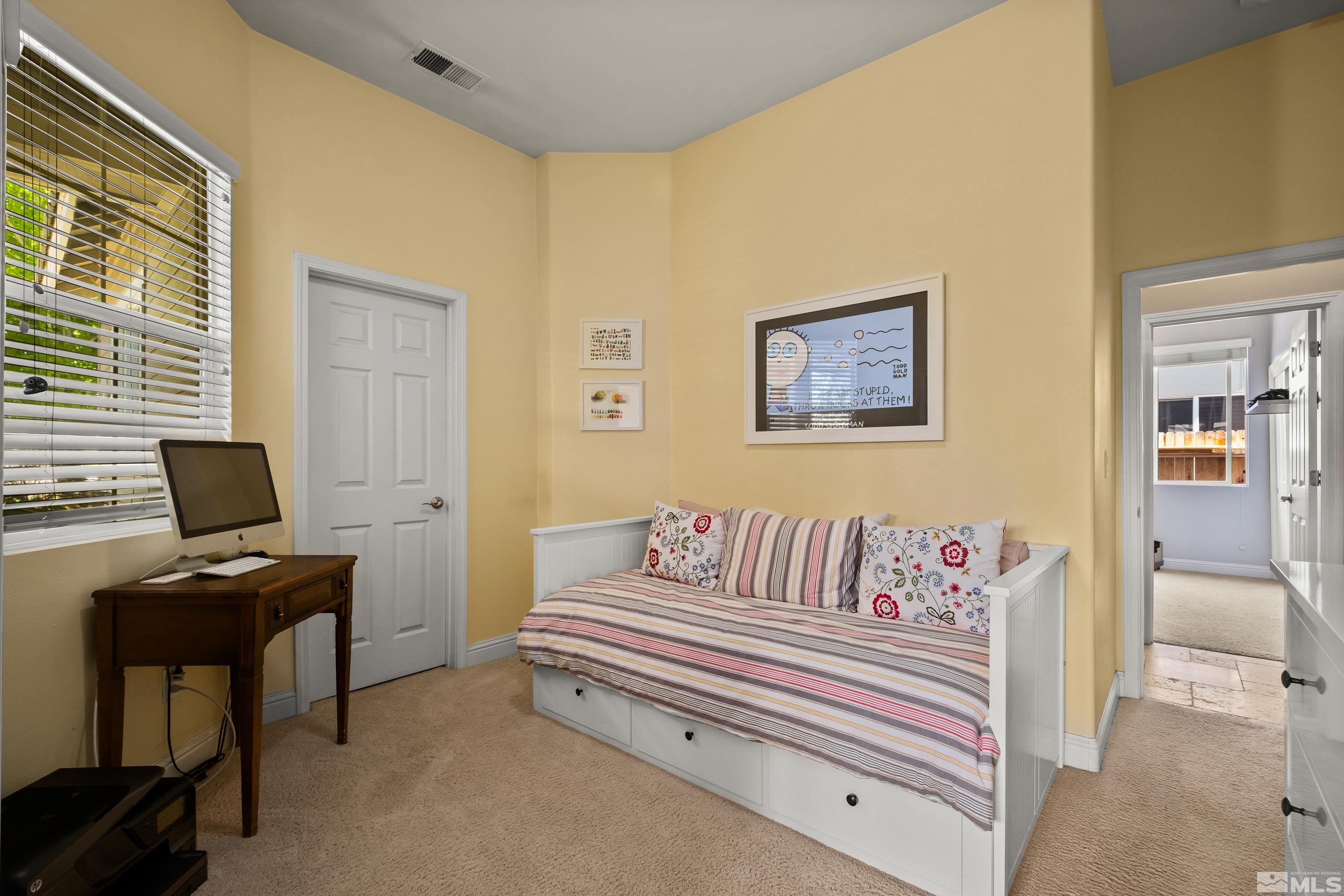 1600 Red Gulch Court Reno, NV 89521 - Photo 23 of 39 a spacious bedroom with a bed and a desk