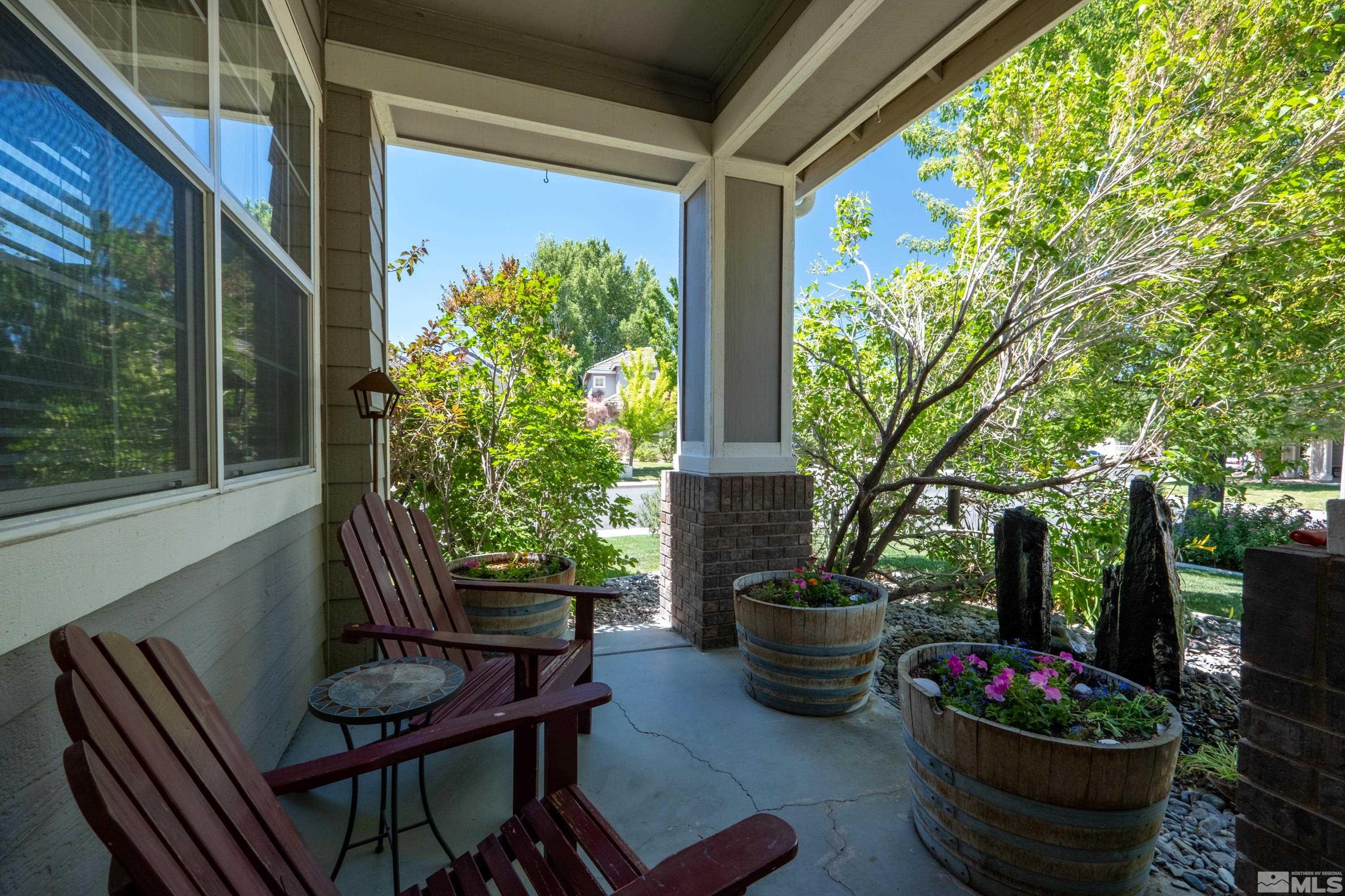 1600 Red Gulch Court Reno, NV 89521 - Photo 8 of 39 a view of a porch with chairs and a potted plant