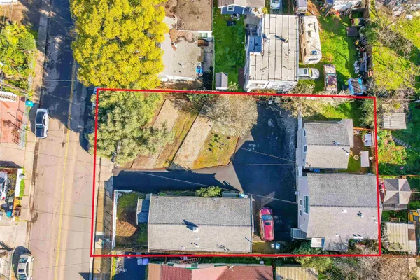 a street sign on a road next to a building