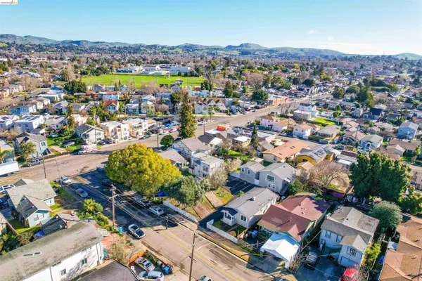an aerial view of residential houses with outdoor space