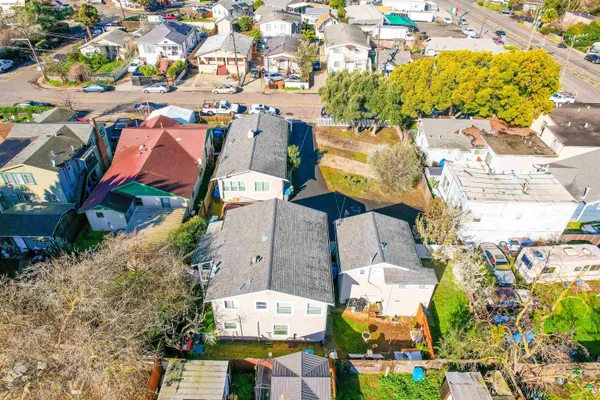 an aerial view of residential houses with outdoor space