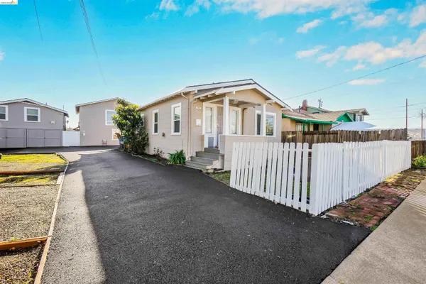 a view of a house with wooden floor and a yard