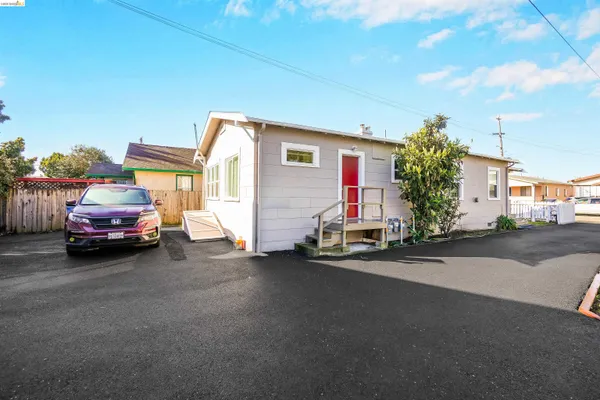 a view of a car park in front of house