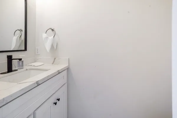 a bathroom with a sink and a mirror