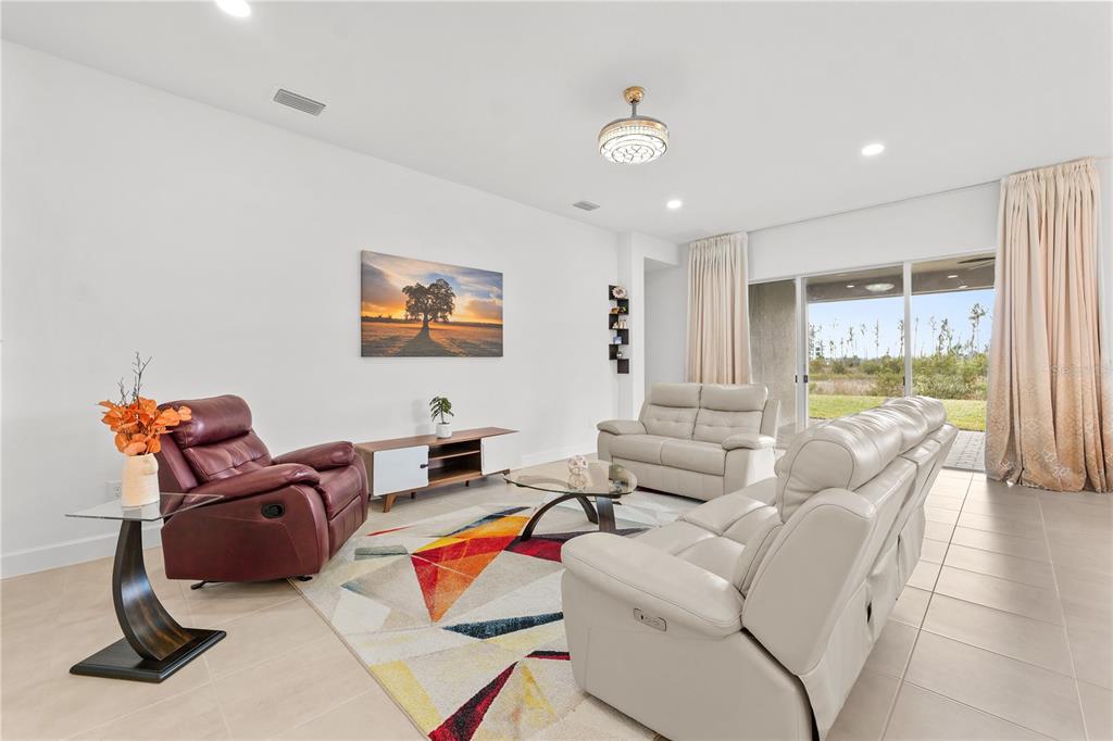 32558 Tree Of Life Avenue Wesley Chapel, FL 33543 - Photo 8 of 73 a living room with furniture