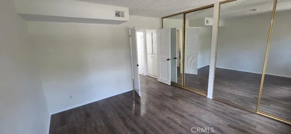 a kitchen with stainless steel appliances granite countertop a refrigerator a sink and a oven