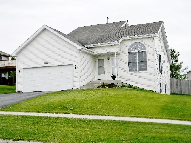 5497 Rockingham Drive Loves Park, IL 61111 - Photo 1 of 25 a view of a house with a yard