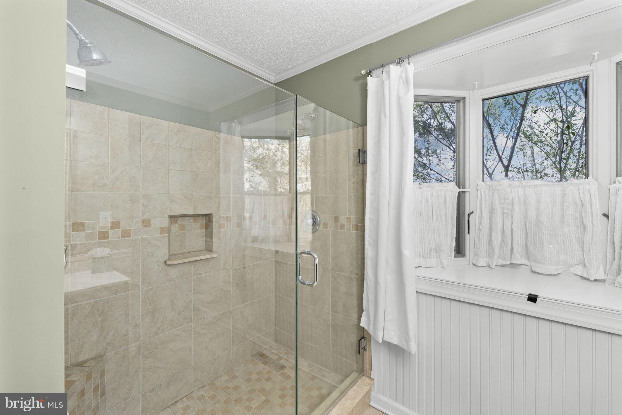 128 Harrison Circle Locust Grove, VA 22508 - Photo 14 of 65 a bathroom with a shower and a sink