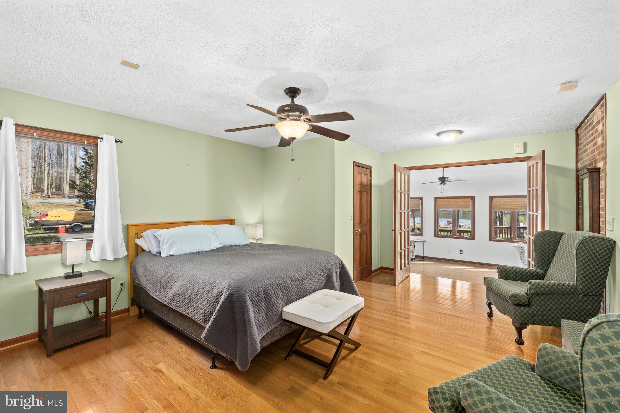 128 Harrison Circle Locust Grove, VA 22508 - Photo 20 of 65 a bedroom with a bed and wooden floor