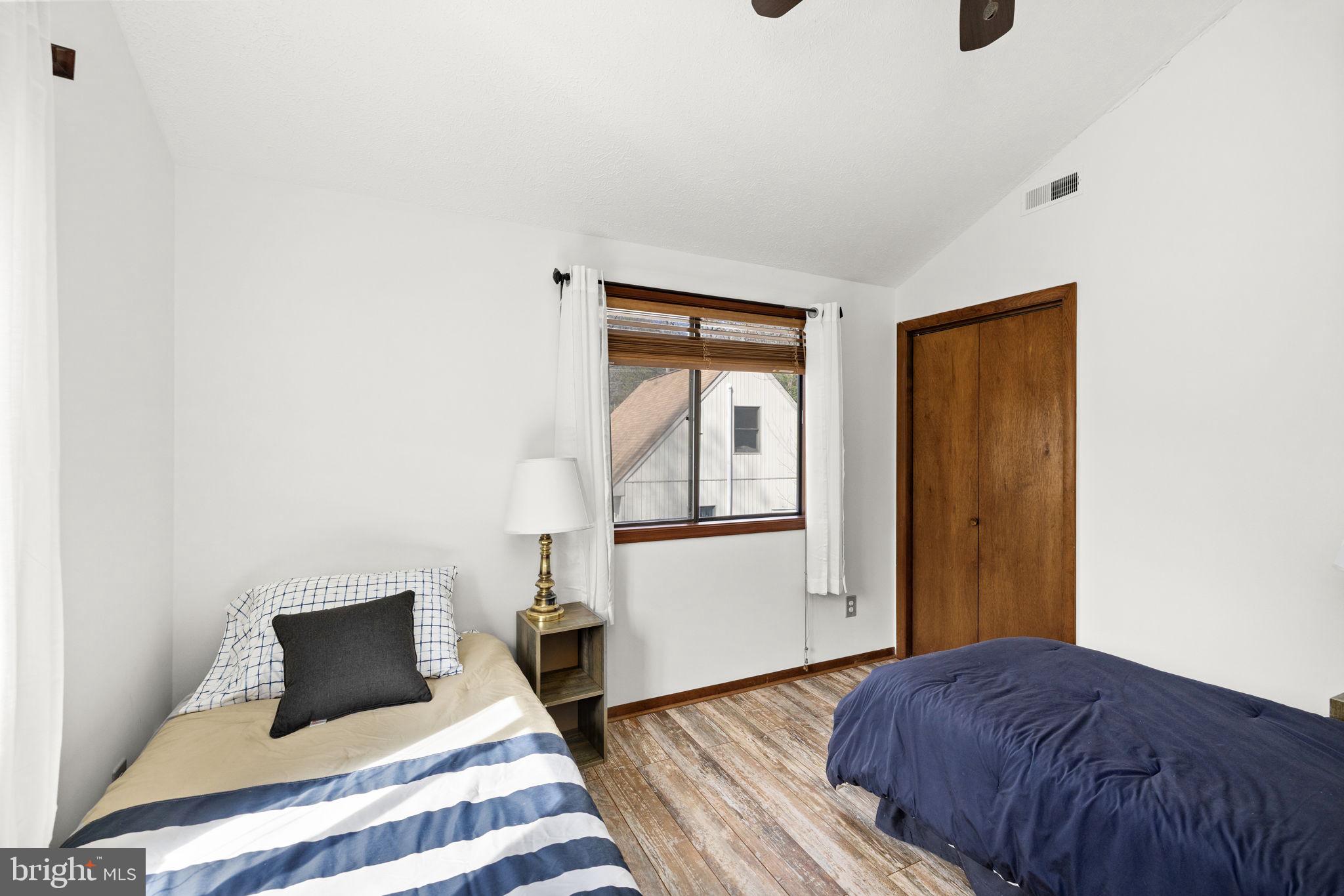 128 Harrison Circle Locust Grove, VA 22508 - Photo 24 of 65 a bedroom with a bed and wooden floor