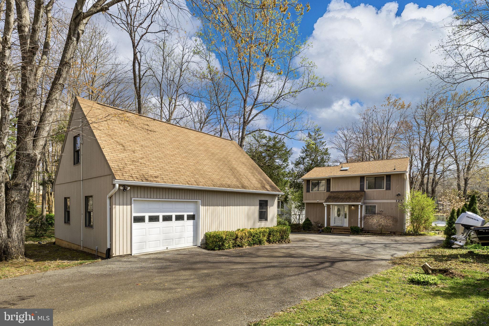 128 Harrison Circle Locust Grove, VA 22508 - Photo 3 of 65 a view of a house with a patio