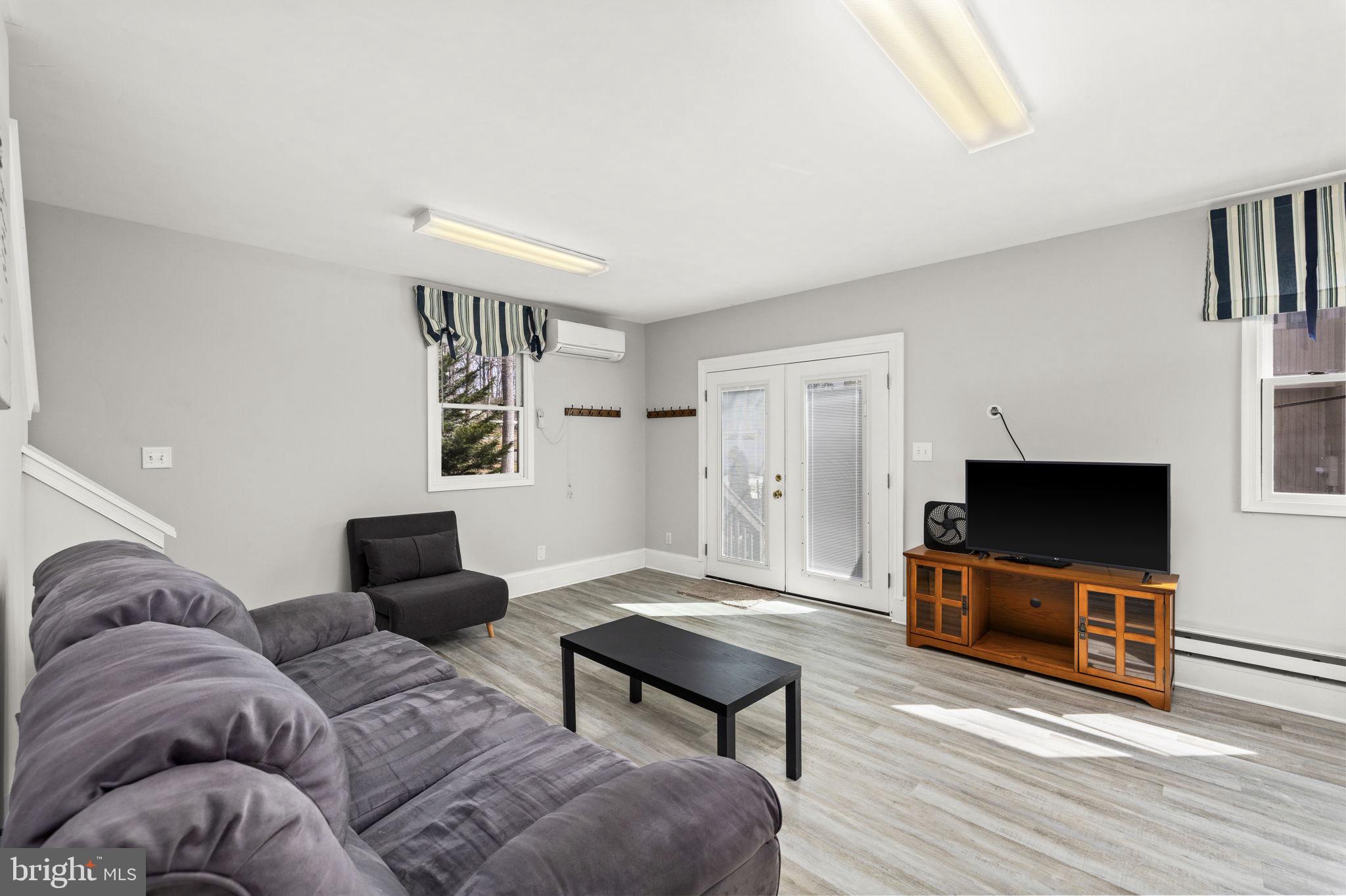 128 Harrison Circle Locust Grove, VA 22508 - Photo 29 of 65 a living room with furniture and a flat screen tv