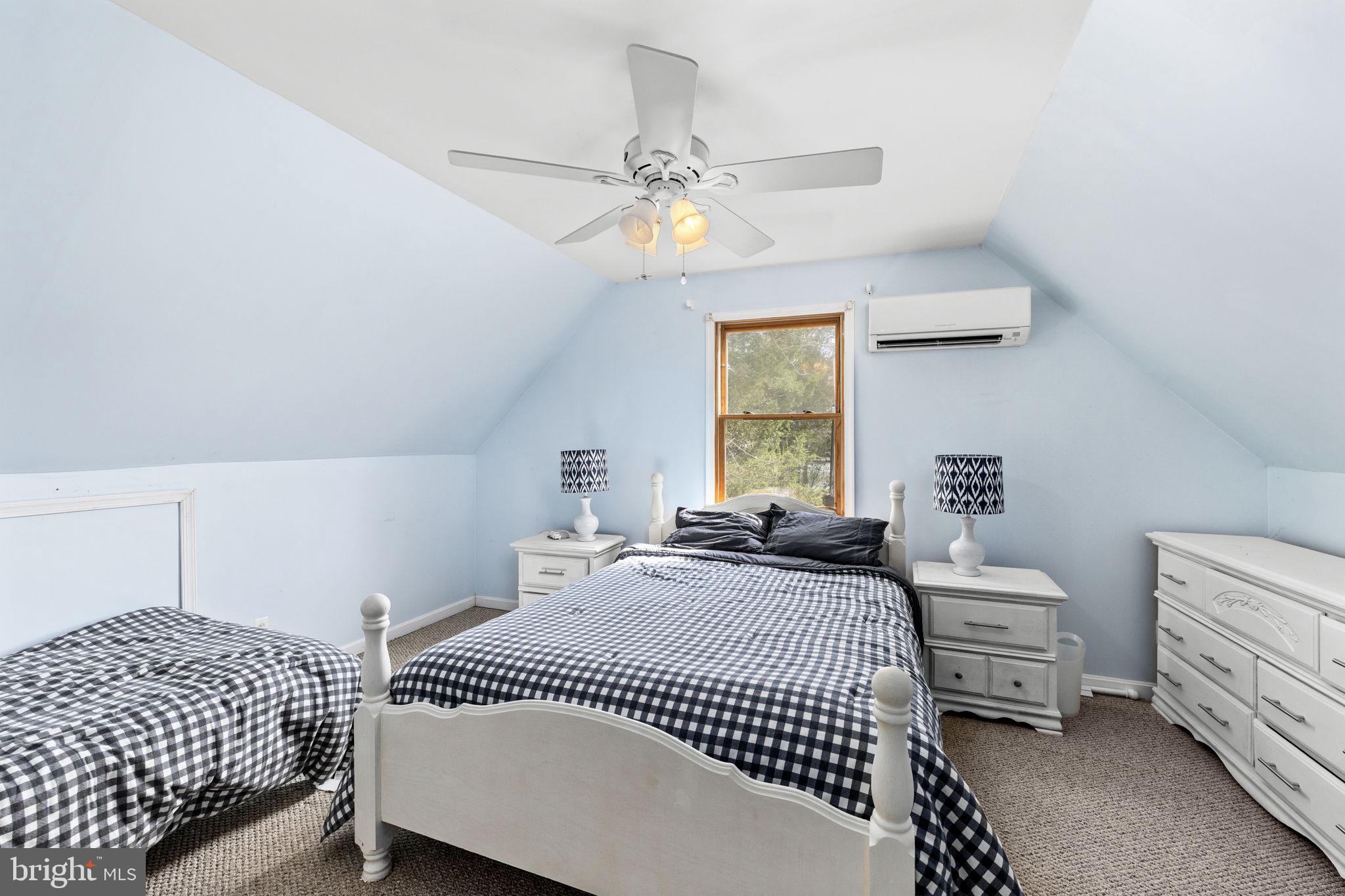128 Harrison Circle Locust Grove, VA 22508 - Photo 31 of 65 a bedroom with a bed and a chandelier