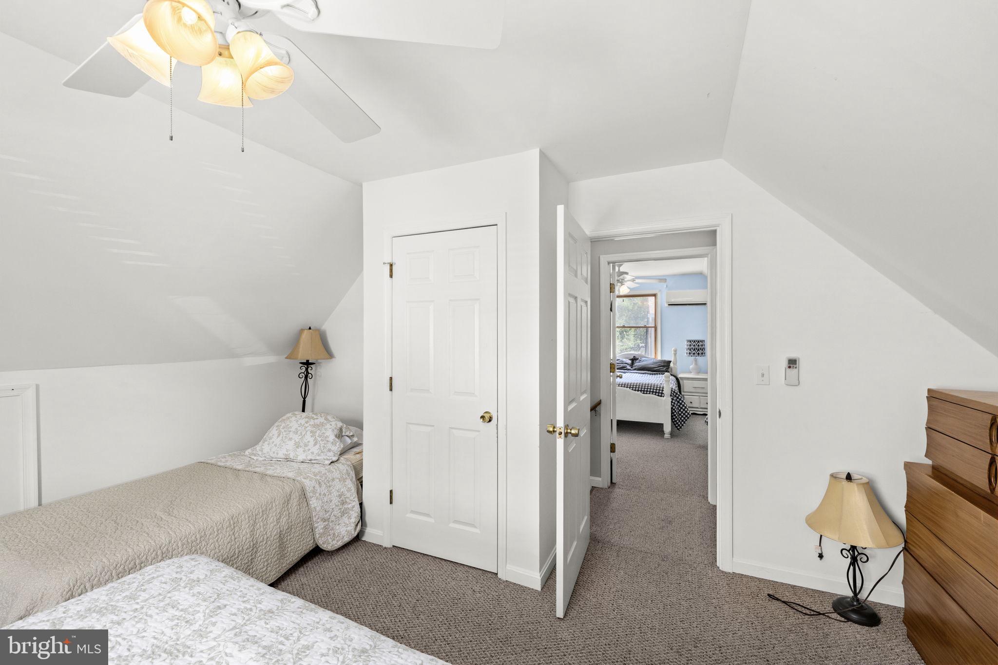 128 Harrison Circle Locust Grove, VA 22508 - Photo 33 of 65 a bedroom with a bed and a chandelier