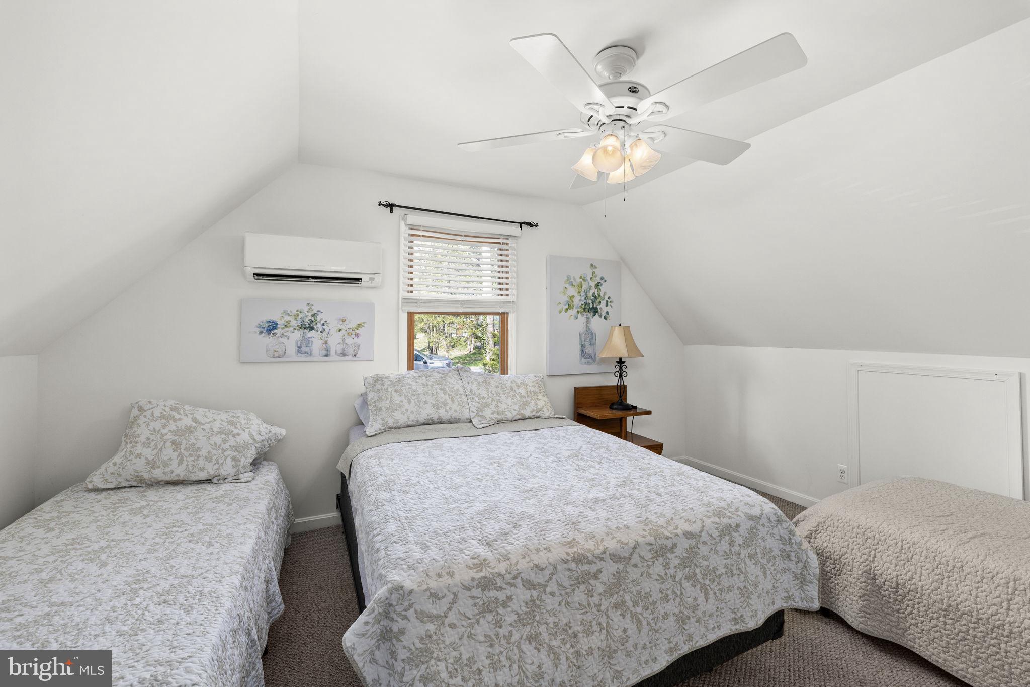 128 Harrison Circle Locust Grove, VA 22508 - Photo 34 of 65 a bedroom with a bed and a chandelier