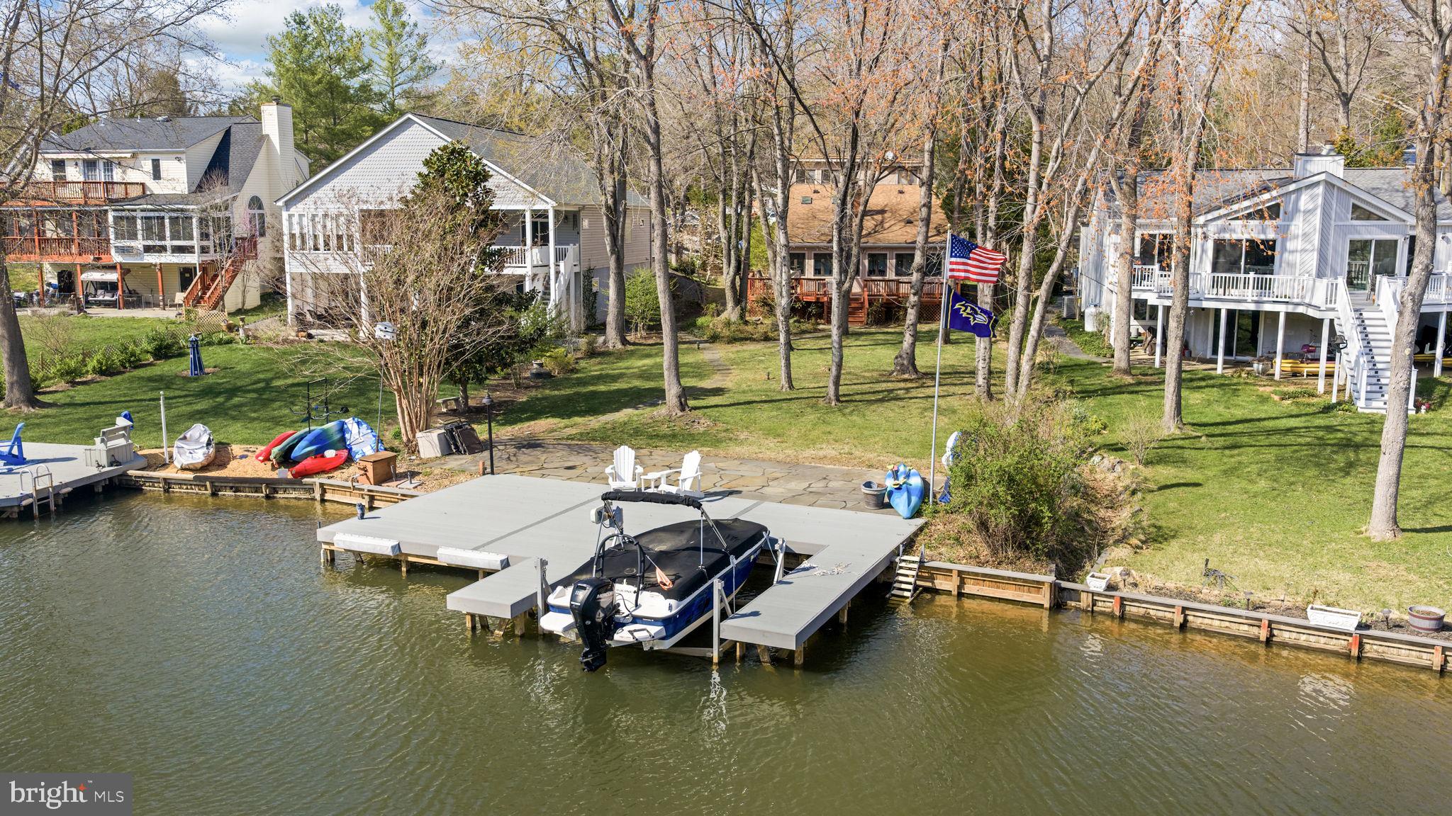 128 Harrison Circle Locust Grove, VA 22508 - Photo 4 of 65 a view of a lake with a house