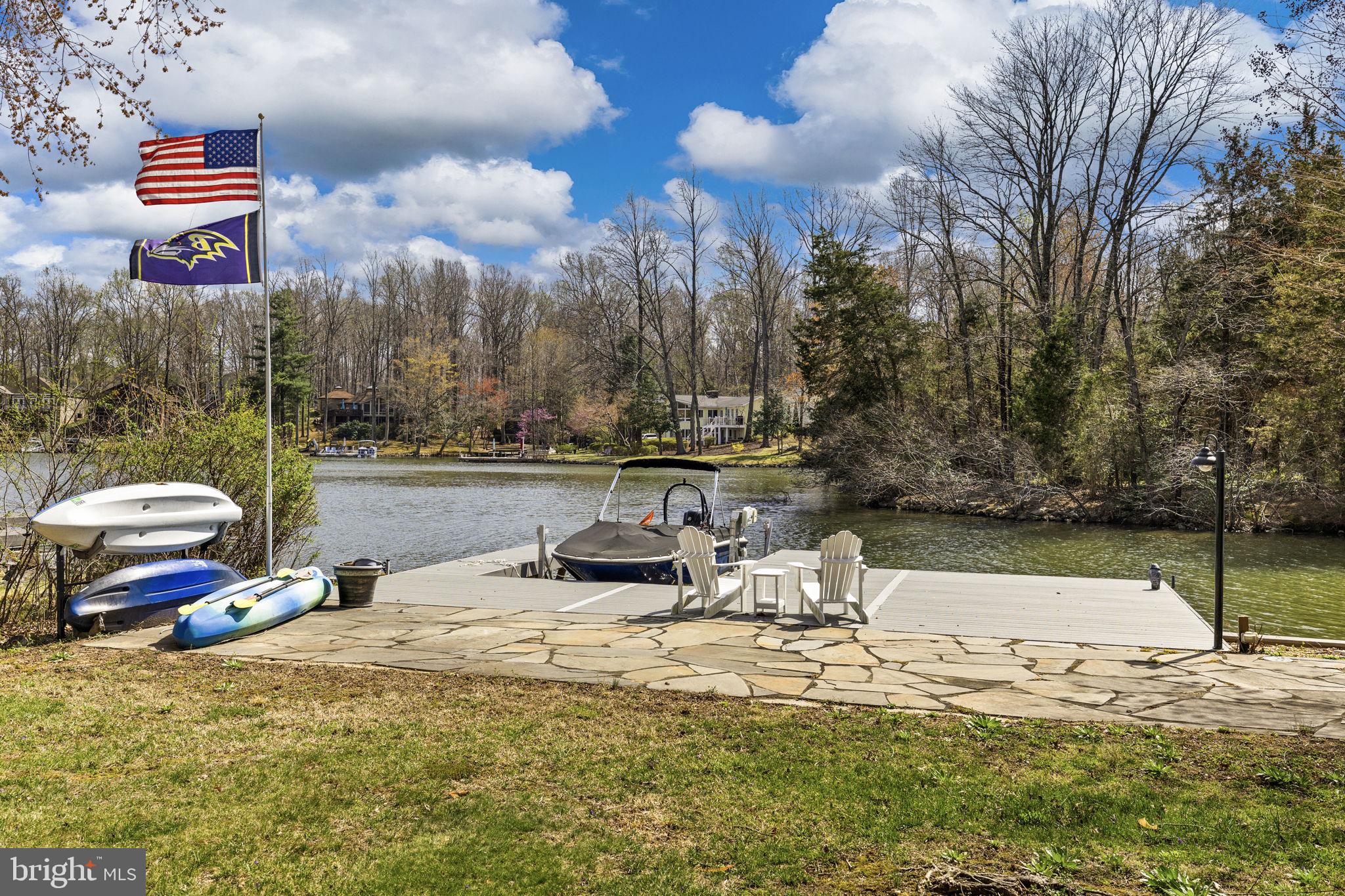128 Harrison Circle Locust Grove, VA 22508 - Photo 41 of 65 a view of a lake with a house