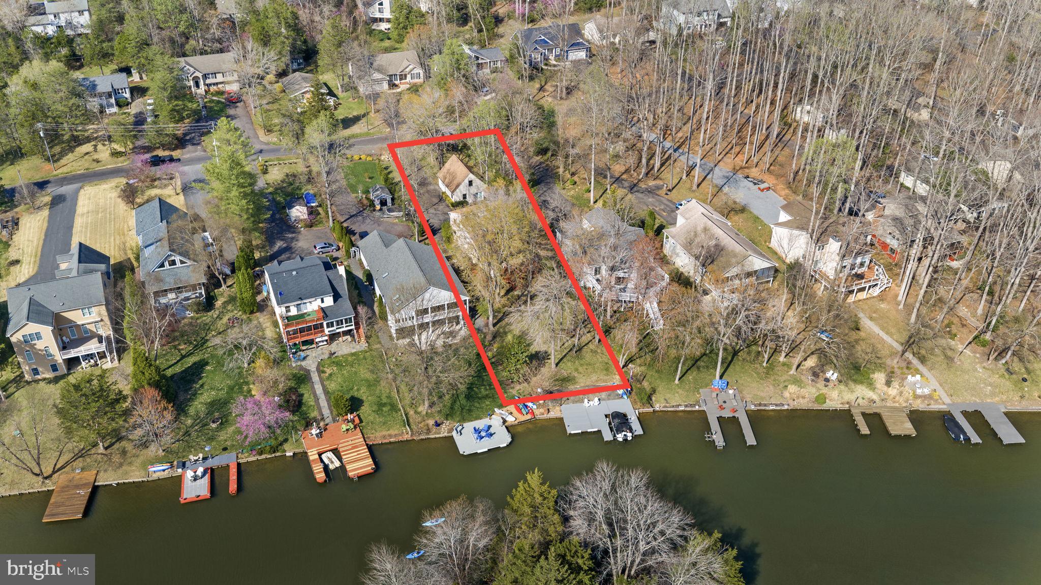 128 Harrison Circle Locust Grove, VA 22508 - Photo 47 of 65 an aerial view of a house with a yard and lake view in back
