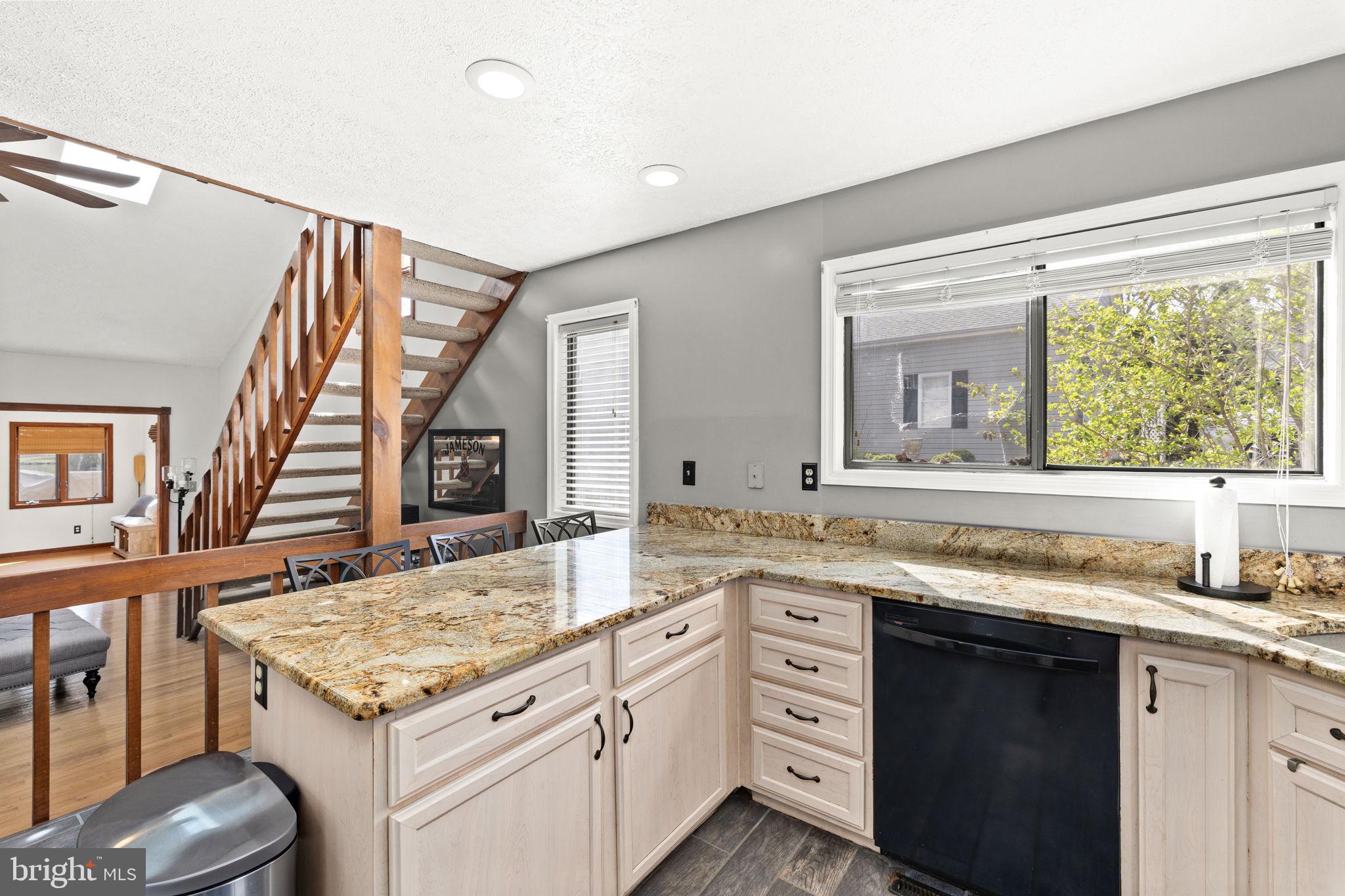 128 Harrison Circle Locust Grove, VA 22508 - Photo 10 of 65 a kitchen with a stove a sink and a wooden cabinets