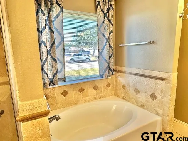 a bath tub sitting next to a window