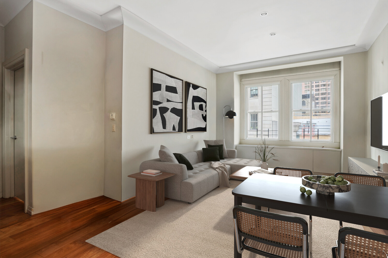55 Wall Street, Unit 834 Manhattan, NY 10005 - Photo 2 of 10 a living room with furniture and a window