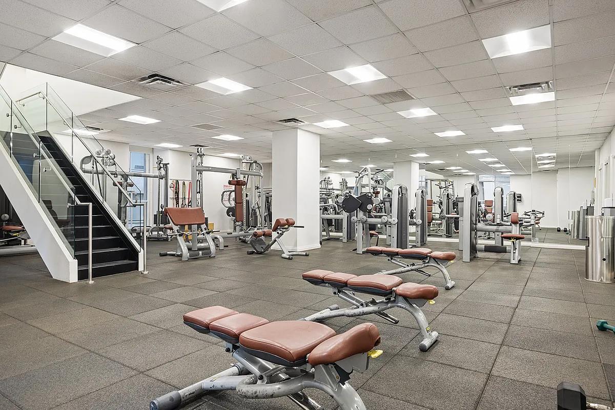 55 Wall Street, Unit 834 Manhattan, NY 10005 - Photo 8 of 10 a room with lots of furniture and lots of furniture