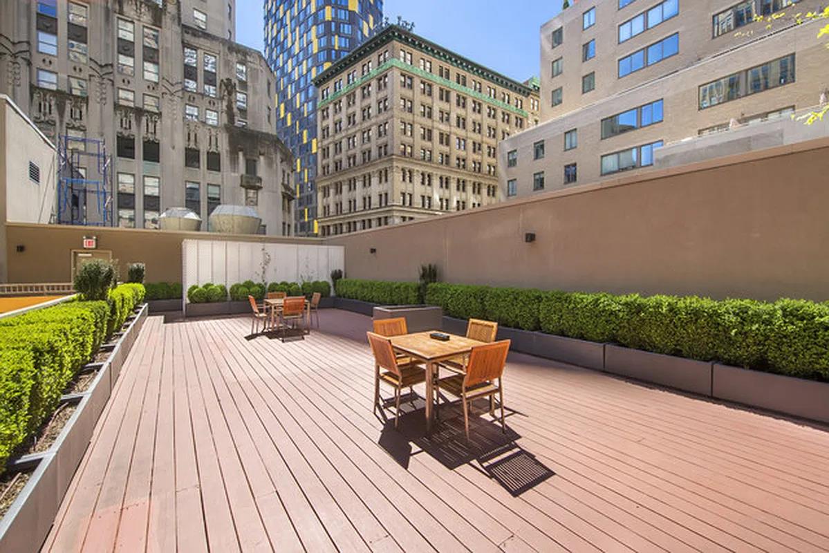 55 Wall Street, Unit 834 Manhattan, NY 10005 - Photo 9 of 10 a terrace view with sitting space